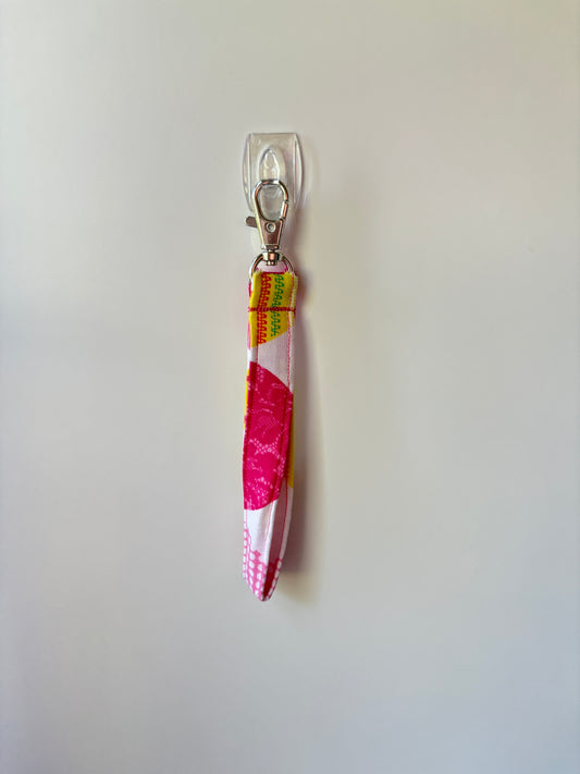 Neon heart wristlet